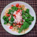 Farfalle with pesto, fresh tomatoes and rocket salad